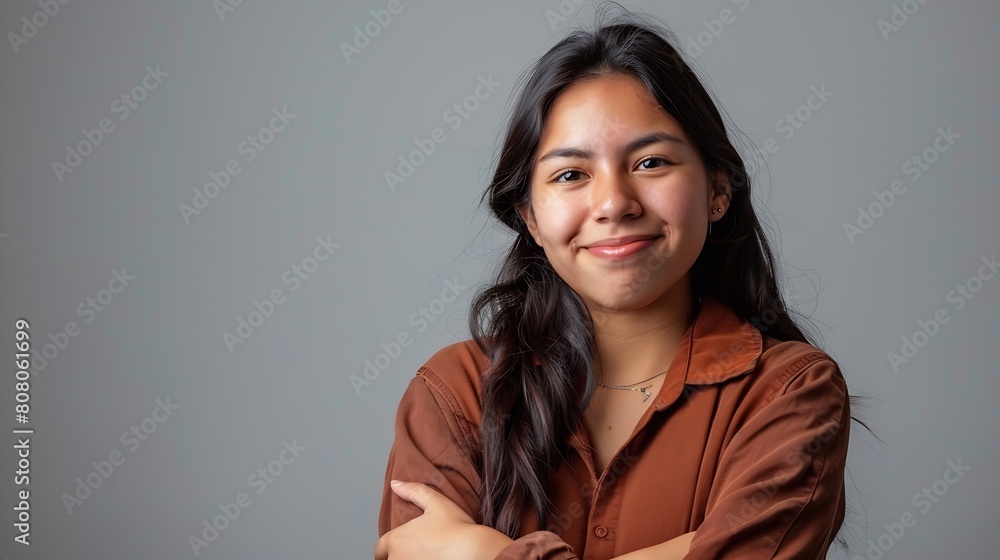 Portrait of a young latin woman with pleasant smile and crossed arms isolated on grey wall with copy space Beautiful girl with folded arms looking at camera against grey wall Cheerful : Generative AI Portrait of a young latin woman with pleasant smile and crossed arms isolated on grey wall with copy space Beautiful girl with folded arms looking at camera against grey wall Cheerful : Generative AI
