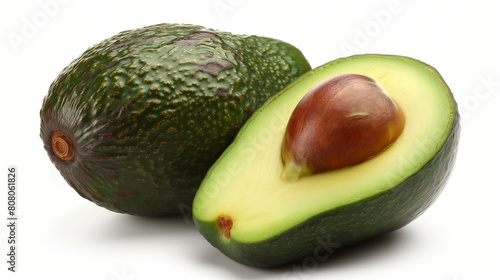 A fresh, ripe avocado alongside a halved piece showing the pit, set against a clean white background, emphasizing health
