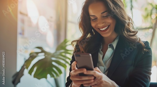 Hispanic businesswoman in formal attire in her office happy and cheerful while using smartphones and working Young businesswoman using apps on cell phones reading news fast connection : Generative AI