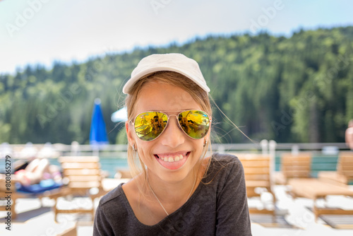 Young teenage girl having fun with her family on a beach vacation