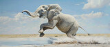 A white elephant is running through the sand and water. The elephant is leaping into the air, and the sky is blue