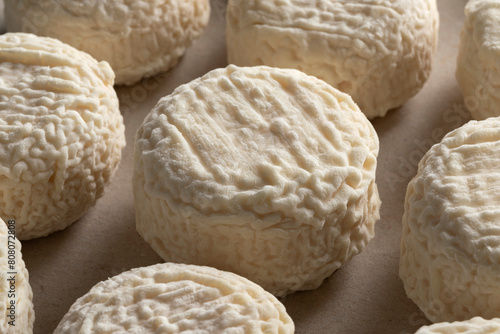 Group of French Crottin de chevre, goat cheese, close up