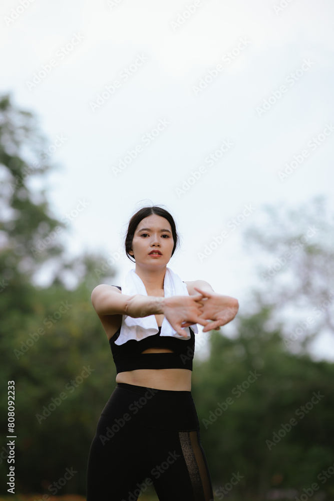 Asian woman exercising in the park Her gaze was determined to lose weight. The concept of healthy lifestyle activities Asian woman exercising in the park Her gaze was determined to lose weight. The concept of healthy lifestyle activities