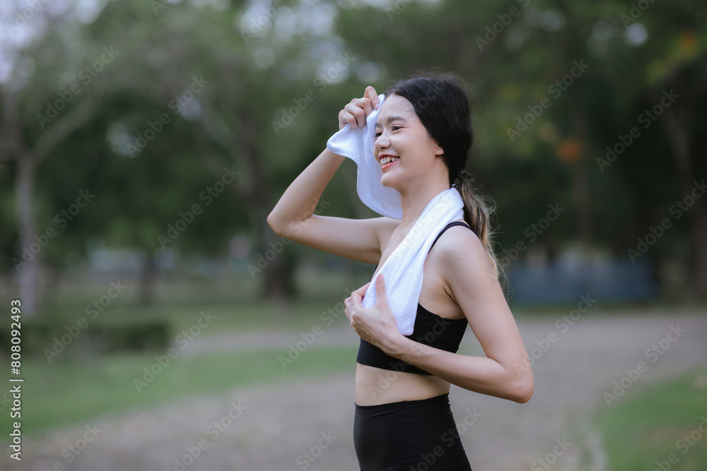 Asian woman exercising in the park Her gaze was determined to lose weight. The concept of healthy lifestyle activities Asian woman exercising in the park Her gaze was determined to lose weight. The concept of healthy lifestyle activities