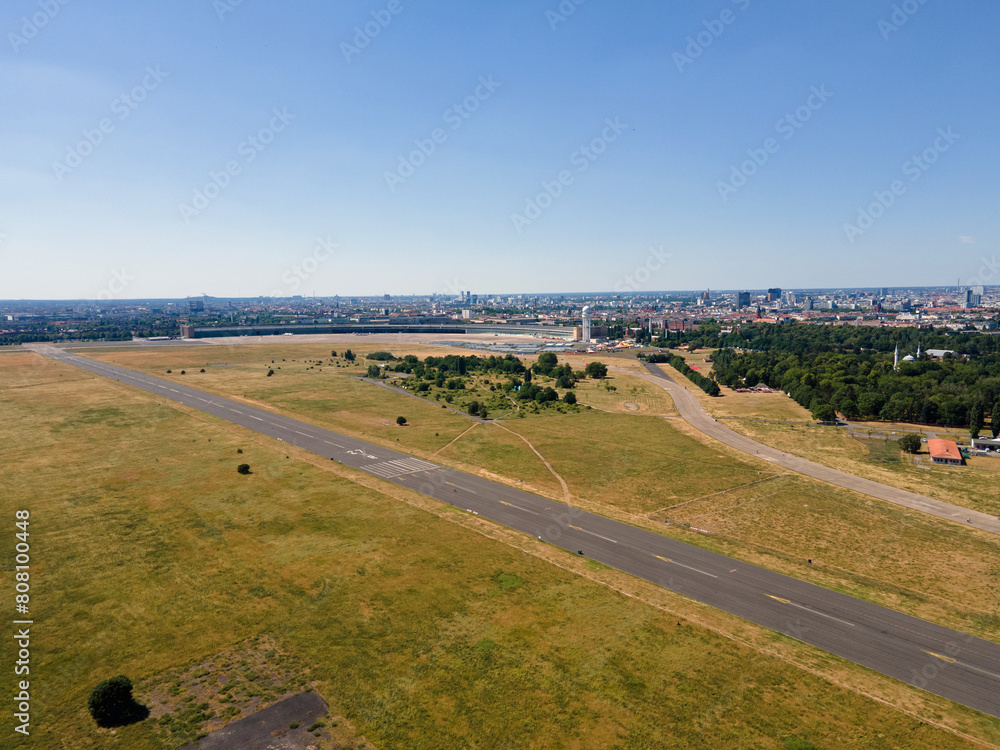 Aerial landscape of Tempelhofer Feld runway at abandoned airport in summer in Central Berlin Aerial landscape of Tempelhofer Feld runway at abandoned airport in summer in Central Berlin