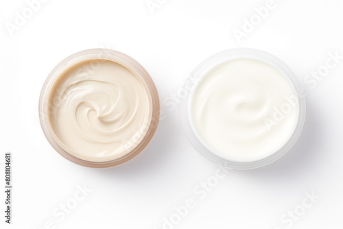 Two opened jars with face cream isolated on white background. Complex skincare concept. Top view, flatlay