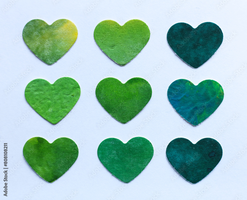 Fototapeta premium Green hearts in watercolor style isolated on white background. Handmade.