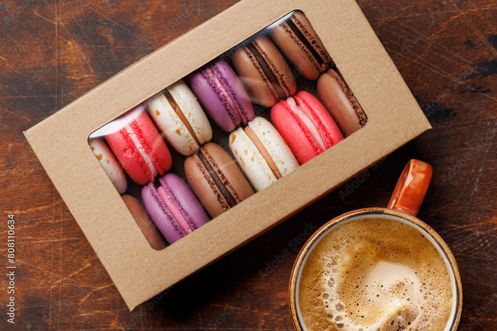 Coffee and colorful macaroons in gift box Coffee and colorful macaroons in gift box