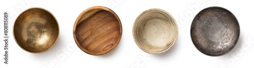 Fotografie set of four small bowls, different materials: a golden brass bowl, two wooden bo