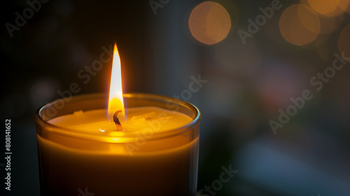 Close-Up of a Lit Scented Candle with Soft Focus