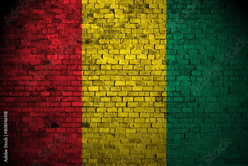 Guinea flag on brick wall