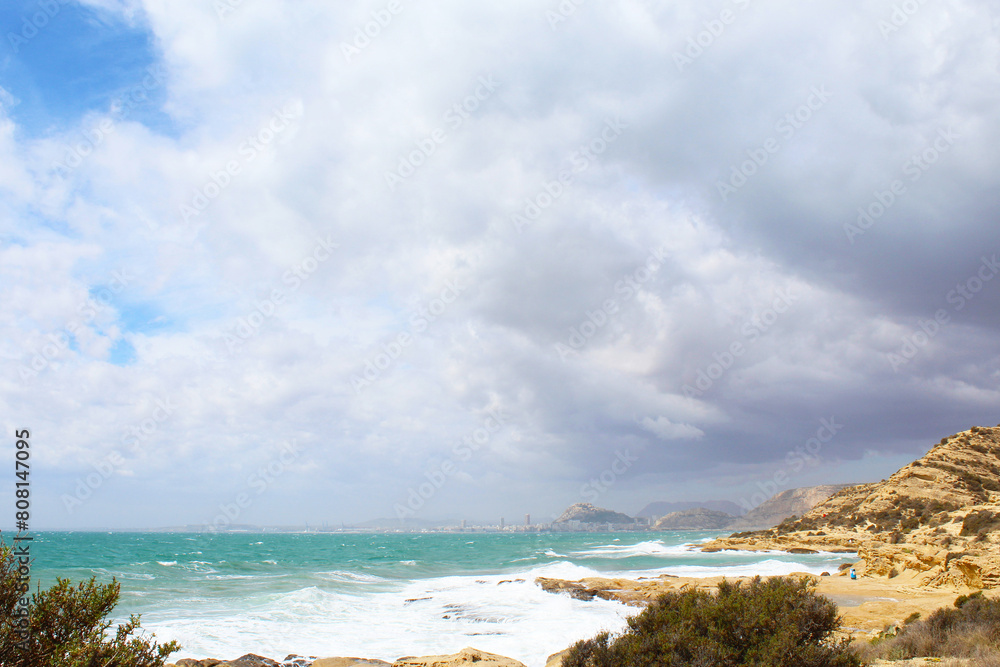 beach with sky, sea waves breaking against the rocks beach with sky, sea waves breaking against the rocks