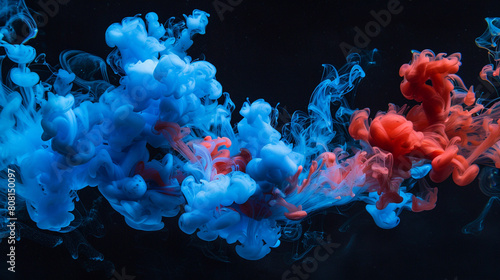 An image capturing the tranquil yet vibrant underwater ballet of blue and red inks as they meld in water against a pitch-black backdrop. 