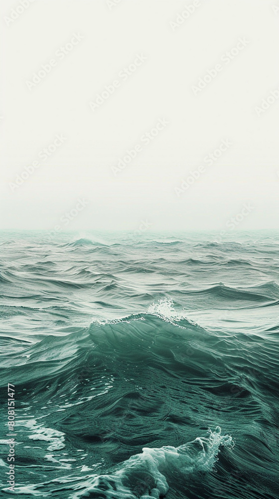 A tranquil blend of seafoam green and soft grey waves, rising like the gentle mist of a calm morning by the sea.