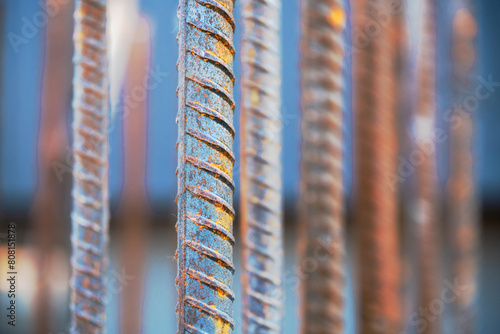 Steel bars or steel reinforcement bars are utilized at construction sites for reinforcing concrete, close-up and selective soft focus.