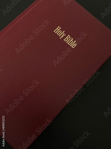 background image of a red bible on a black background