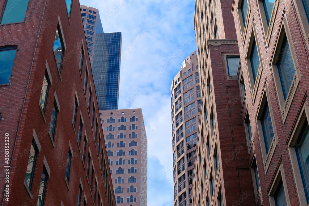 Fototapeta premium Canary wharf street with buildings facade general view in Boston city, american city skyline 