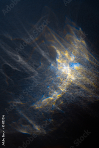 Yellow and blue abstract background, interference patterns formed by light.