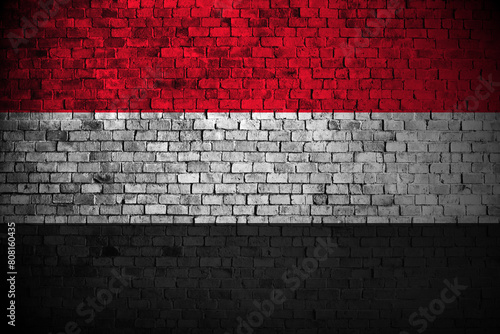 yemen flag on brick wall photo