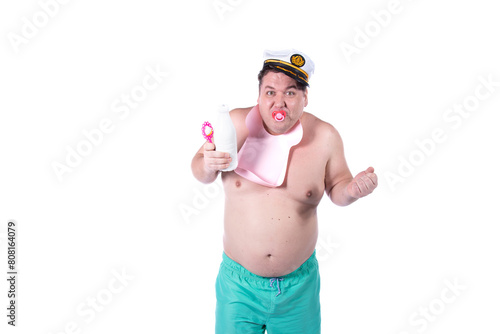 Funny day. Satisfied fat man in a child's costume. The guy poses in the studio on a white background. Fun and joy. photo