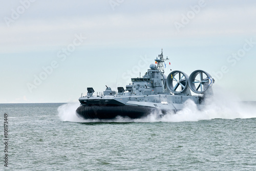 Photos Hovercraft warship armed with armament sails into sea toward military target to