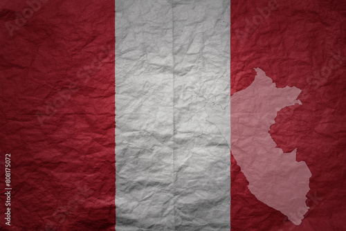 big national flag and map of peru on a grunge old paper texture background photo