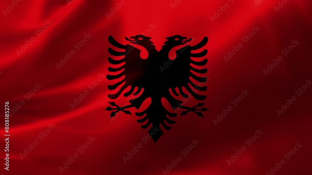 Realistic HD flag of the Albania waving in the wind. Close up of Albania Flag Slow Waving with visible. flag background texture with vibrant colors and fabric background Realistic HD flag of the Albania waving in the wind. Close up of Albania Flag Slow Waving with visible. flag background texture with vibrant colors and fabric background
