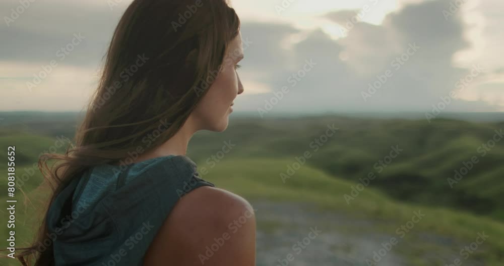 Woman relax green hills landscape at sunset. Long hair brunette girl looking on beautiful nature scene, close up side view. Freedom, happiness lifestyle. Travel, tourism, holiday. Slow motion 4K Woman relax green hills landscape at sunset. Long hair brunette girl looking on beautiful nature scene, close up side view. Freedom, happiness lifestyle. Travel, tourism, holiday. Slow motion 4K