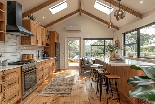 a modern kitchen with countertop pantry and dining area advertising photography