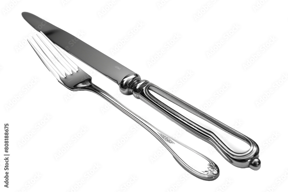 A fork and knife are shown side by side on a white background A fork and knife are shown side by side on a white background