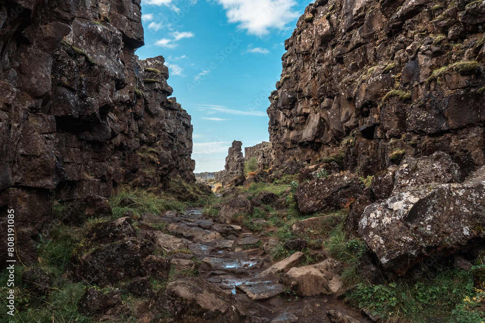 Almannagja fault, long rocky gorge in Iceland. Golden Circle, Þingvellir Park, walk along the canyon between two tectonic plates.
