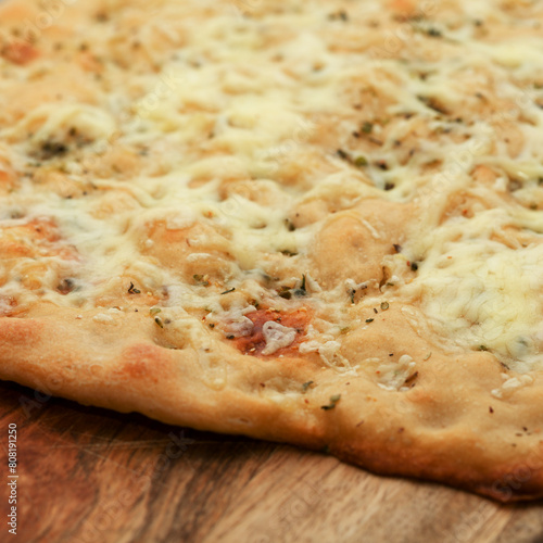 Sourdough leavened Focaccia bread with rosemary and cheese photo