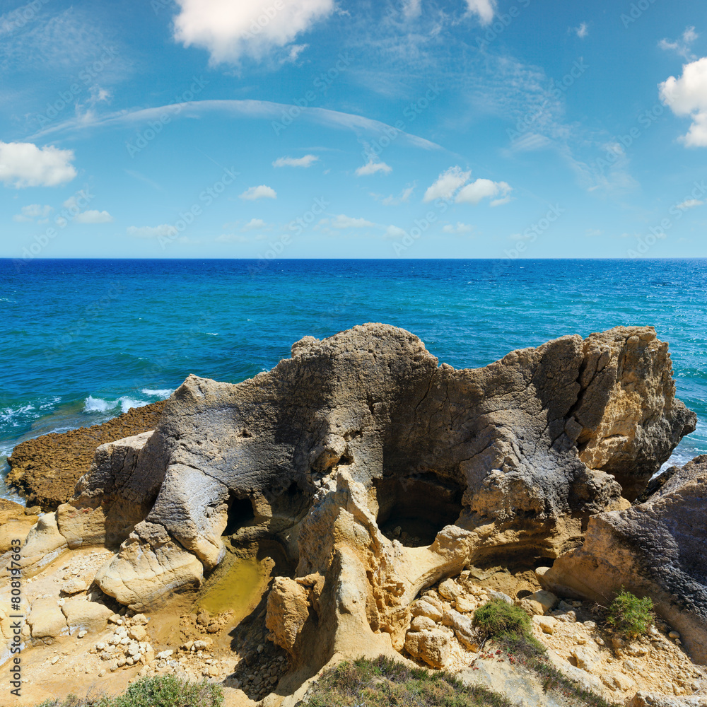 Summer Atlantic rocky coast view (Albufeira outskirts, Algarve, Portugal).