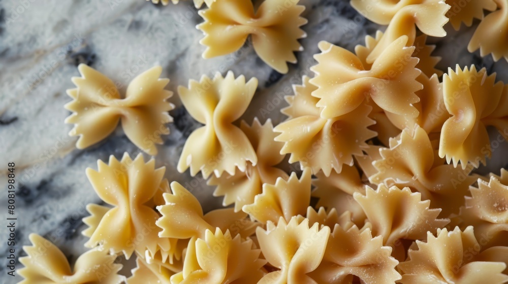 A tight shot of pasta shells atop a marble counter, surrounded by a marble surface background A tight shot of pasta shells atop a marble counter, surrounded by a marble surface background