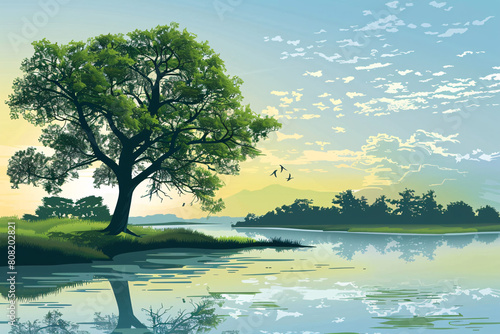 serene landscape with a tree by water at sunrise, birds in the sky. photo