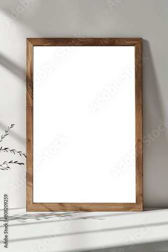 Closeup of vertical wooden frame interior mockup leaning against white wall in clean room
