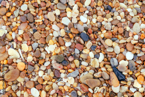 background of pebbles on the beach close up