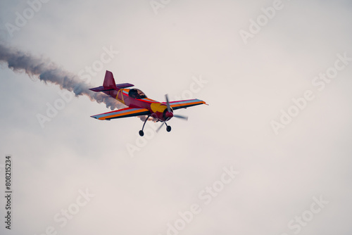Colorful stunt plane performing at air show photo