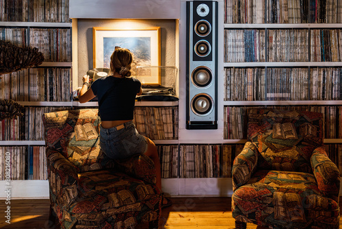 Vinyl record enthusiast in a cozy music room photo