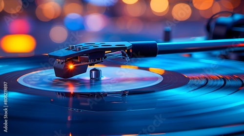 High-fidelity vinyl record player with vibrant blue and orange bokeh background photo
