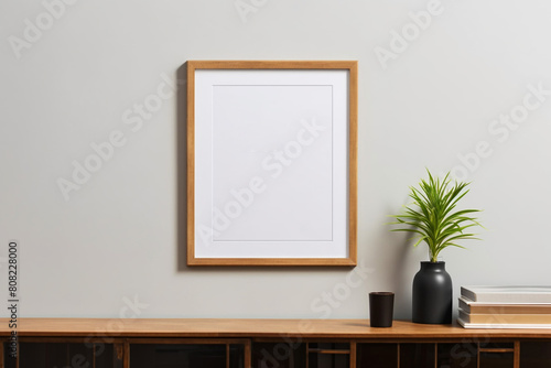 A mock-up of a poster in a wooden frame on a table with house plants and a lamp. generated AI
