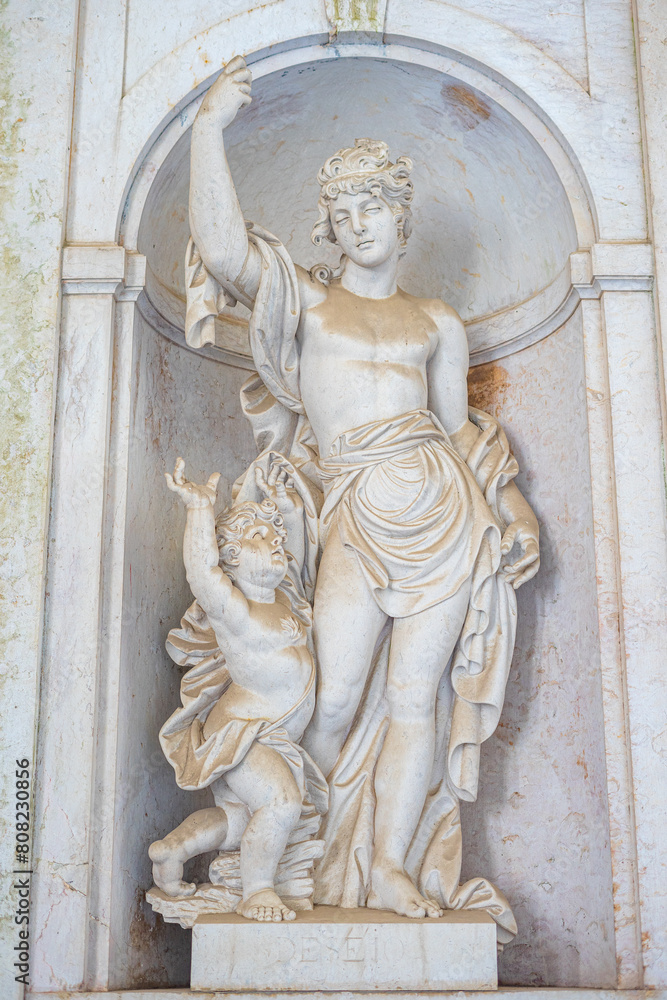 Stone statue representing desire inside the Ajuda Palace in Lisbon-Portugal. Stone statue representing desire inside the Ajuda Palace in Lisbon-Portugal.