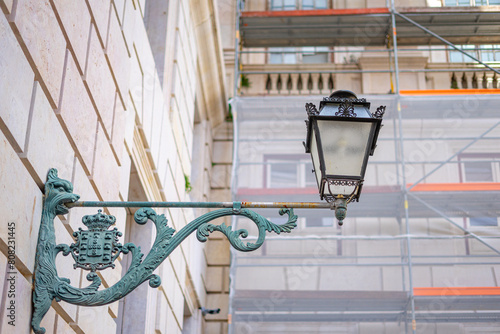 Public wall lamp outside the cloisters of the Ajuda Palace, Lisbon-Portugal. photo