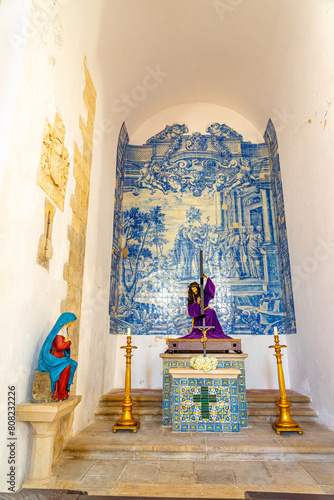 Side chapel with arched windows in the interior nave of the church of São João Alporão, Santarém-Portugal.