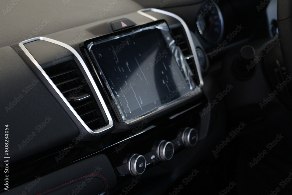 Selective focus Interior of a modern car, Car Air Conditioner with screen display on console.