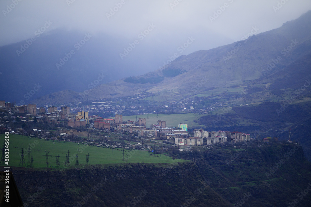 Fototapeta premium Alaverdi town and Sanahin village in foggy weather, Armenia
