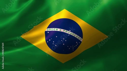 Realistic HD flag of the Brazil waving in the wind. Close up of Brazil Flag Slow Waving with visible wrinkles. flag background texture with vibrant colors and fabric background photo