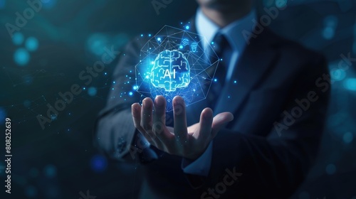 A businessman holding an AI brain in his hand. The brain is connected to a network of other brains, representing the interconnectedness of artificial intelligence. AIG51A. photo