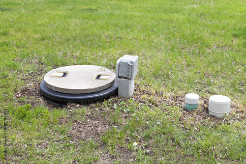 Septic tank alarm system. Concrete septic tank with alarm system and inspection port