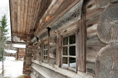 window with carved frames of a wooden house